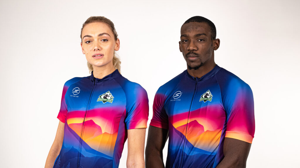 A male and female model wearing the 2022 Dragon Ride official Jersey and cycling vest